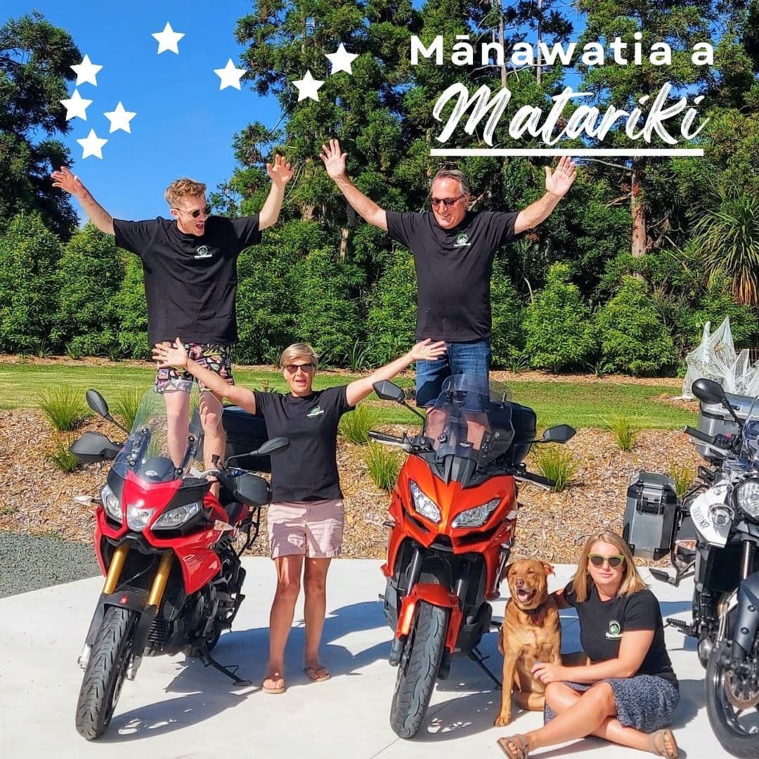 Family photo standing in front of a couple motorcycles